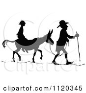 Clipart Of Silhouetted Men With A Donkey 1 Royalty Free Vector Illustration by Prawny Vintage