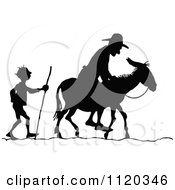 Poster, Art Print Of Silhouetted Men With A Donkey 2