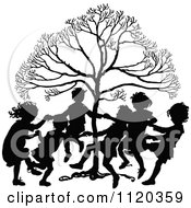 Poster, Art Print Of Silhouetted Children Dancing Around A Tree