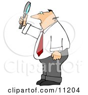 Balding Caucasian Businessman Holding Up And Looking Through A Magnifying Glass