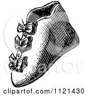 Clipart Of A Retro Vintage Black And White Baby Boot Shoe Royalty Free Vector Illustration
