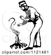 Clipart Of A Retro Vintage Black And White Klondiker Gold Rush Miner Man Warming By A Fire Royalty Free Vector Illustration