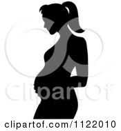 Clipart Of A Black Silhouette Of A Pregnant Mother Holding Her Belly Royalty Free Vector Illustration