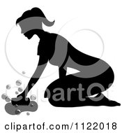 Clipart Of A Silhouetted Male Scrubbing A Floor On Her Knees Royalty Free Vector Illustration