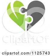 Clipart Of A Green And Gray Organic Heart Puzzle With A Reflection Royalty Free Vector Illustration by elena