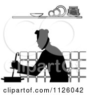 Clipart Of A Black And White Chef Cooking In A Kitchen 1 Royalty Free Vector Illustration