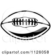 Clipart Of A Black And White American Football 7 Royalty Free Vector Illustration