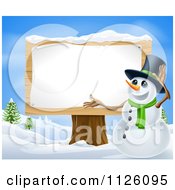 Poster, Art Print Of Winter Snowman Presenting A Wooden Sign