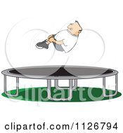 Boy Hugging His Knees In The Air Over A Trampoline