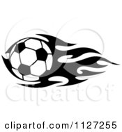 Clipart Of A Black And White Soccer Ball With Tribal Flames 3 Royalty Free Vector Illustration