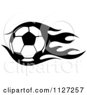 Clipart Of A Black And White Soccer Ball With Tribal Flames 1 Royalty Free Vector Illustration