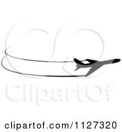 Clipart Of A Black Silhouetted Airplane And Trails 8 Royalty Free Vector Illustration by Vector Tradition SM