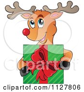 Cute Happy Reindeer Holding A Christmas Present
