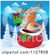 Poster, Art Print Of Cute Reindeer Holding A Present Over A Sack In The Snow