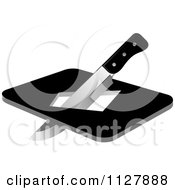 Clipart Of A Kitchen Knife And Board With A Hole Royalty Free Vector Illustration