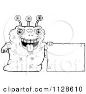 Cartoon Clipart Of An Ugly Alien With A Sign Black And White Vector Coloring Page