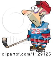 Cartoon Of A Hockey Player With A Puck Stuck In His Helmet Royalty Free Vector Clipart