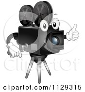 Cartoon Of A Happy Analog Movie Camera Mascot Holding A Thumb Up Royalty Free Vector Clipart