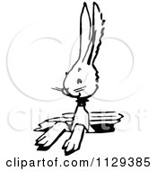 Clipart Of A Retro Vintage Black And White Bunny In A Hole Royalty Free Vector Illustration