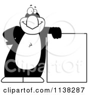 Cartoon Clipart Of An Outlined Penguin Leaning On A Sign Black And White Vector Coloring Page