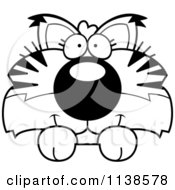 Cartoon Clipart Of An Outlined Cute Bobcat Cub Hanging Over A Sign Black And White Vector Coloring Page