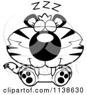 Cartoon Clipart Of An Outlined Cute Sleeping Tiger Cub Black And White Vector Coloring Page