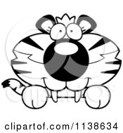 Cartoon Clipart Of An Outlined Cute Happy Tiger Cub Hanging Over A Sign Black And White Vector Coloring Page