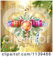 Clipart Of A Wood Christmas Background With Gifts Branches A Bauble And Gold Grunge Royalty Free Vector Illustration