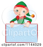 Poster, Art Print Of Cute Christmas Elf Boy Pointing Down At A Snow Sign
