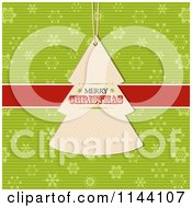 Merry Christmas Tree Label Over A Red Ribbon And Green Snowflakes