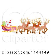 Poster, Art Print Of Santa Waving From His Sleigh While Holding The Reins To His Reindeer