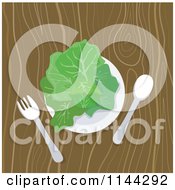 Plate Of Greens On A Wooden Table