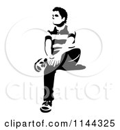 Clipart Of A Black And White Young Man Waiting In A Chair 1 Royalty Free Vector Illustration