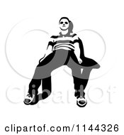Clipart Of A Black And White Young Man Waiting In A Chair 2 Royalty Free Vector Illustration