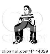 Clipart Of A Black And White Young Man Waiting In A Chair 3 Royalty Free Vector Illustration