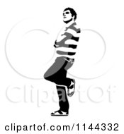 Clipart Of A Black And White Young Man Waiting And Leaning Royalty Free Vector Illustration