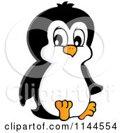 Cartoon Of A Cute Little Penguin Sitting Royalty Free Vector Clipart