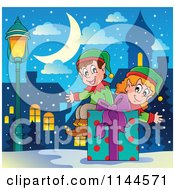 Cartoon Of Happy Christmas Elves Sitting On A Gift Box In A Snowy City Royalty Free Vector Clipart by visekart