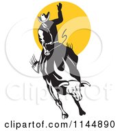 Clipart Of A Retro Rodeo Cowboy On A Bucking Bull 1 Royalty Free Vector Illustration