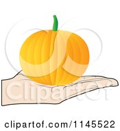 Clipart Of A Hand Holding A Pumpkin In Its Palm Royalty Free Vector Illustration by Andrei Marincas