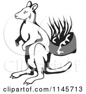 Clipart Of A Black And White Wallaby By Plants Royalty Free Vector Illustration