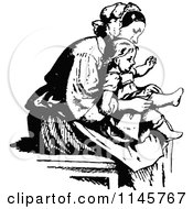 Retro Vintage Black And White Mother Putting Socks On Her Daughter