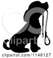 Clipart Of A Silhouetted Puppy Sitting With A Leash In Its Mouth Royalty Free Vector Illustration