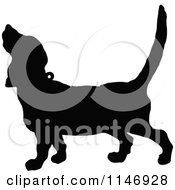 Clipart Of A Retro Vintage Silhouetted Howling Dog Royalty Free Vector Illustration