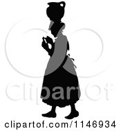 Retro Vintage Silhouetted Woman With A Jar On Her Head