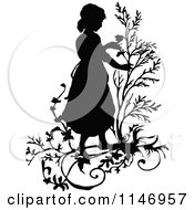 Clipart Of A Retro Vintage Black And White Silhouetted Girl With Branches Royalty Free Vector Illustration