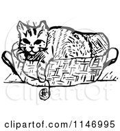 Clipart Of A Retro Vintage Black And White Cat In A Basket With Yarn Royalty Free Vector Illustration