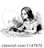 Clipart Of A Retro Vintage Black And White Girl Playing With A Doll Royalty Free Vector Illustration
