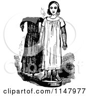 Clipart Of A Retro Vintage Black And White Doll And Dress Royalty Free Vector Illustration