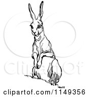 Clipart Of A Retro Vintage Black And White Alert Rabbit Royalty Free Vector Illustration